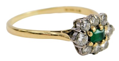 Lot 306 - An 18ct gold emerald and diamond oval flower...