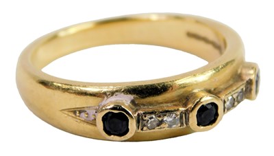 Lot 302 - An 18ct gold sapphire and diamond set band,...