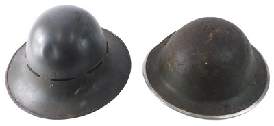 Lot 102 - A WWII period British army helmet...