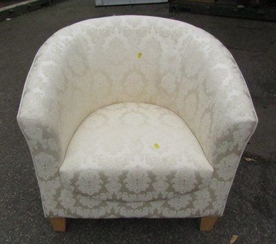 Lot 1108A - A tub chair upholstered in cream coloured fabric.