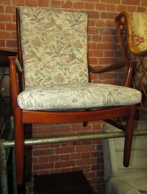 Lot 1026A - An armchair upholstered in floral fabric.