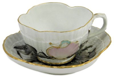 Lot 524B - A German porcelain cup and saucer, decorated...