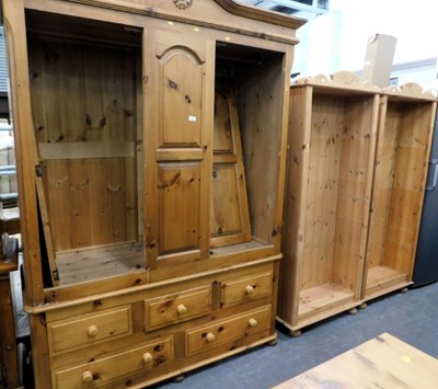 Lot 1501 - A large pine two door wardrobe, above five...