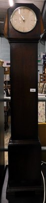 Lot 1506 - A 1930s oak cased grandmother clock, the...