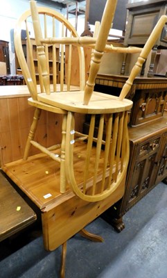 Lot 1520 - A pair of arched spindle back pine kitchen...
