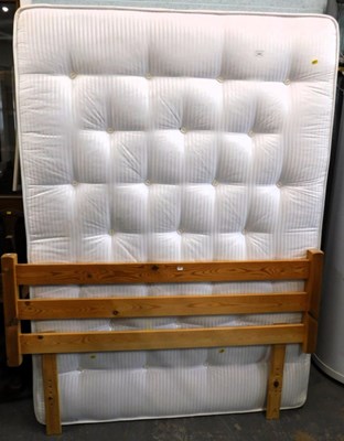 Lot 1537 - A double bed and mattress, with a slatted pine...