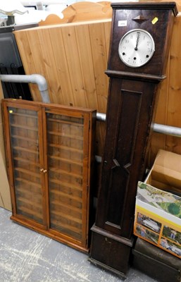 Lot 1570 - An oak cased upright hall clock, with carved...