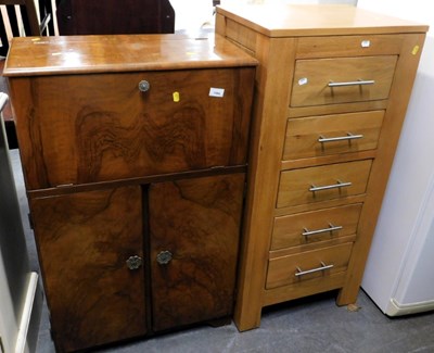 Lot 1594 - A walnut mid-century cocktail cabinet, with...