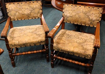 Lot 1606 - A pair of mid-century oak armchairs, with...