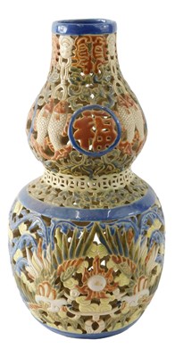 Lot 167 - A modern Chinese ceramic reticulated double...