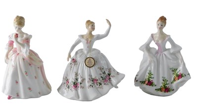 Lot 195 - Three Royal Doulton figurines, Shirley, (AF),...