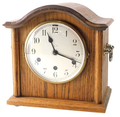 Lot 203 - An early 20thC oak cased mantel clock, with...