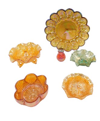 Lot 223 - A quantity of marigold coloured carnival glass,...