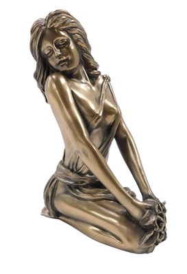 Lot 242 - A bronze effect resin sculpture of a kneeling...