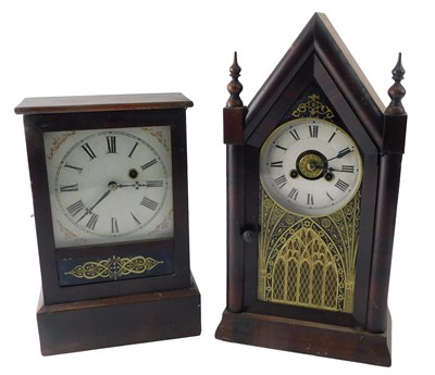 Lot 275 - An American mahogany mantel clock, with Gothic...