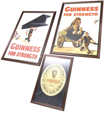 Lot 303 - Three reproduction Guinness posters, to...