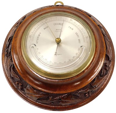 Lot 310 - An early 20thC aneroid barometer, the dial...