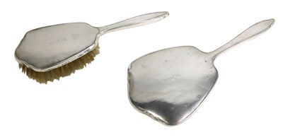 Lot 357 - A silver mounted and engine turned mirror, and...