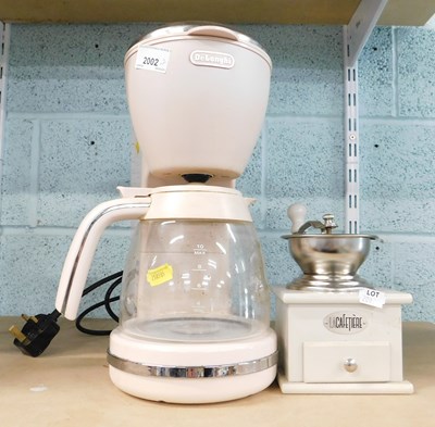 Lot 2002 - A Delonghi cafetiere, in pink, together with a...