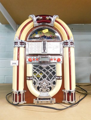 Lot 2006 - A CD player, modelled as a juke box, 40cm high.