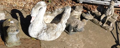 Lot 1663 - A group of concrete and other garden ornaments,...