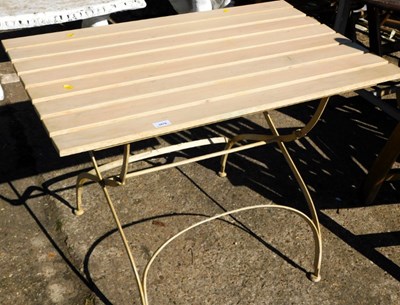 Lot 1670 - A painted garden table, wooden slatted top, on...