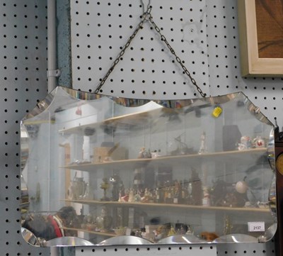 Lot 2137 - A rectangular bevelled wall mirror, 36cm x 55cm.