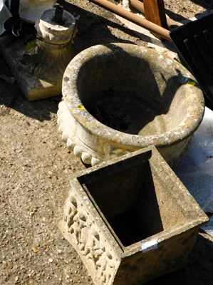 Lot 1673 - A composition stone garden planter, on a...