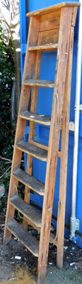 Lot 1674 - A wooden A frame step ladder.