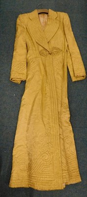 Lot 2185 - A 1950s Oriental style yellow silk ladies...