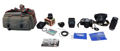 Lot 448 - A Canon OM10 camera, with lens and various...