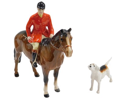 Lot 479 - A Beswick figure of a huntsman, riding a brown...