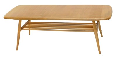 Lot 18 - An Ercol light elm rectangular coffee table,...