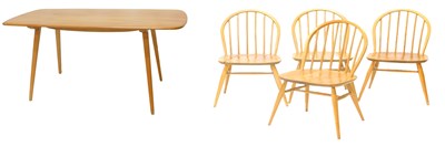 Lot 19 - An Ercol light elm dining table, the...