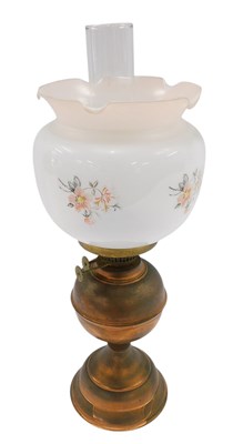 Lot 656 - A copper oil lamp, with opaque floral...