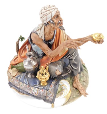 Lot 670 - A capodimonte porcelain figure of an Arab,...