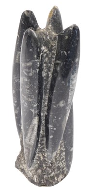 Lot 673 - A polished group of four fossils, 23cm high.