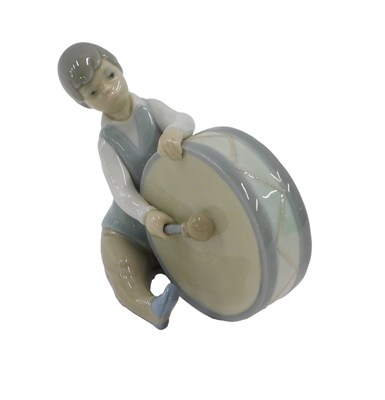 Lot 514 - A Lladro porcelain figure of a boy with a...