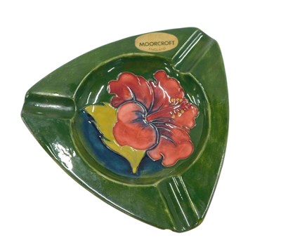 Lot 515 - A Moorcroft pottery triangular ash tray,...