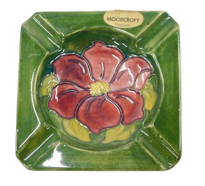 Lot 516 - A Moorcroft pottery square ash tray, decorated...