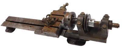 Lot 693 - A metal lathe chuck, etc., 68cm long.