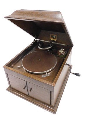 Lot 696 - A HMV wind up gramophone, in oak case, 36cm wide.