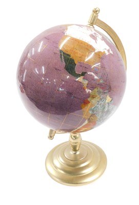 Lot 830 - A gilt globe, inset with various semi-precious...