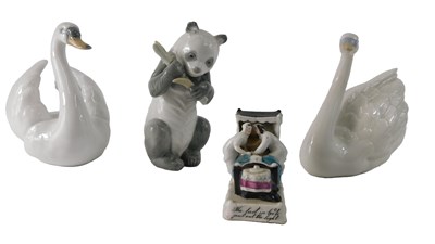 Lot 863 - A Nao porcelain panda, a 19thC German fairing...