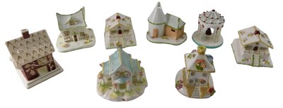 Lot 871 - A collection of eight Coalport cottages, to...