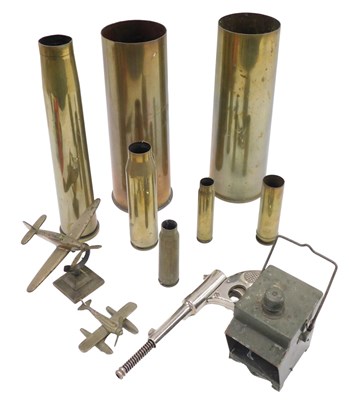 Lot 898 - A collection of brass shell cases, a brass...