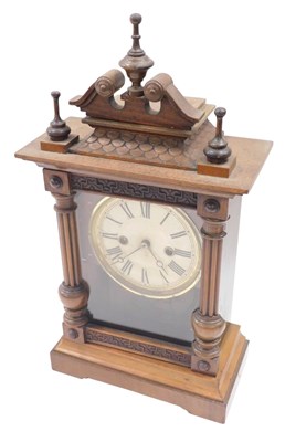 Lot 931 - A late 19thC German walnut cased mantel clock,...