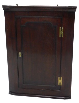 Lot 952 - An early 19thC oak corner cabinet, with single...