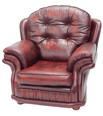 Lot 968 - A red leather upholstered armchair, with...