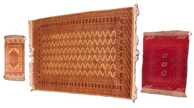 Lot 975 - An Afghan type rug, the design of medallions...